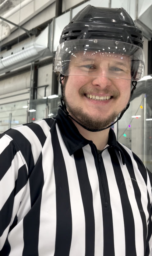 PIR referee officiating a game on the ice